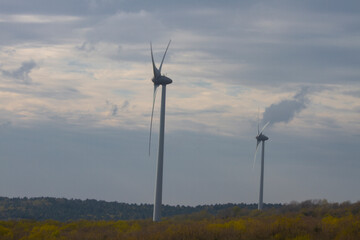 A wind turbine is a system that converts the kinetic energy in the wind first into mechanical...