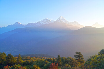 Nature Landscape Annapurna mountain on himalaya rang mountain in the morning seen from Poon Hill, Nepal - Blue Nature view  - hikes to epic mountains and adventurous backpacking