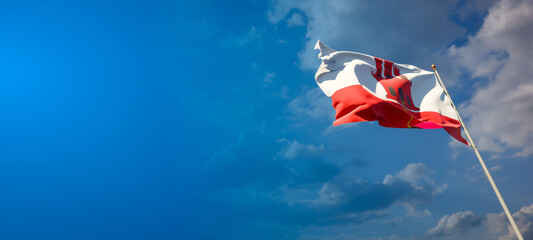 Beautiful national state flag of Gibraltar with blank space. Gibraltar flag on wide background with place for text 3D artwork.