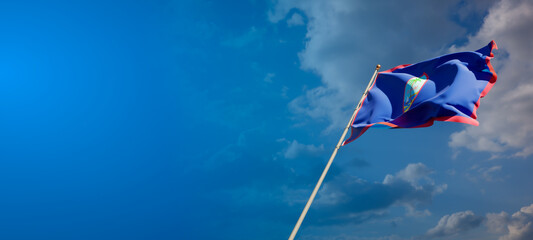 Beautiful national state flag of Guam with blank space. Guam flag on wide background with place for text 3D artwork.