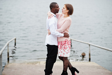 Fototapeta premium Happy multiethnic couple in love story. Relationships of african man and white european woman.