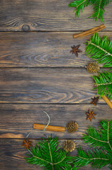Christmas food background with copy space for text, cinnamon sticks, star anise seasoning and spices pine branches