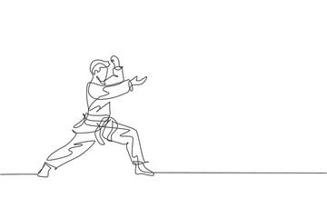 One continuous line drawing of young talented karateka man train pose for duel fighting at dojo gym center. Mastering martial art sport concept. Dynamic single line draw design vector illustration © Simple Line