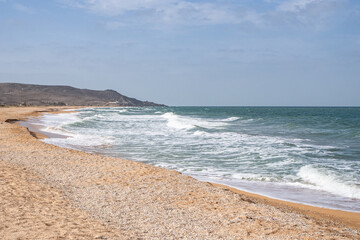 The storm and the waves of the sea. Sandy beach. Vacation, vacation,