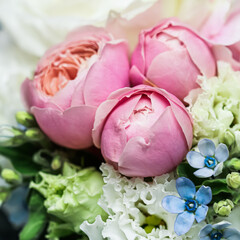 Beautiful flower bouquet arrangement close up in pastel colors. Decoration of roses and decorative plants, selective focus