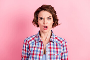 Photo portrait of upset woman with open mouth isolated on pastel pink colored background