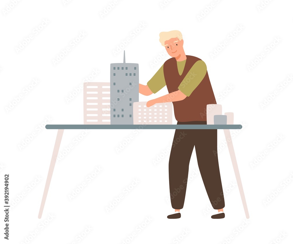 Poster young male architect install mini city building models on table. professional engineer or designer w