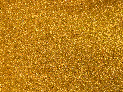 Premium Photo  Gold flakes abstract background.