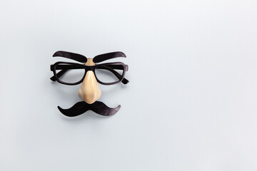Carnival mask with moustache, nose and glasses on grey background, copy space. Concept men's...