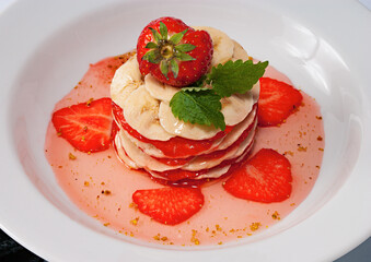banana and strawberry dessert with syrup