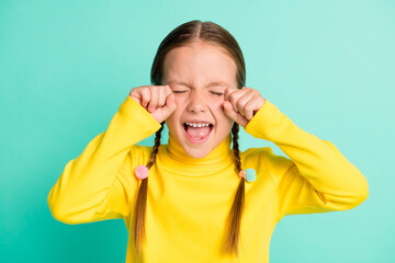 Photo of unhappy sad brown haired little girl cry stressed offended isolated on shine teal color...