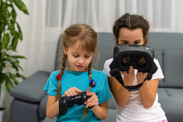 Young girls with virtual reality glasses. VR headset.