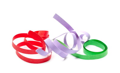 Colorful ribbons, curls, strips, decoration for celebrations and holidays isolated on white background and texture