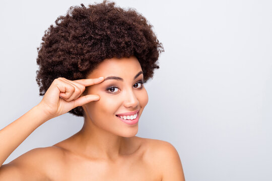 Close up photo of charming afro american girl enjoy eyes lifting pampering procedure make skin flawless smooth silky shiny ideal pure wellness isolated over grey color background
