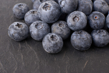 Berry background. Fresh berry blueberries on a white background. Concept of healthy and diet food. Flat lay, top view, Ripe blueberries with copy space for text, shallow DOF