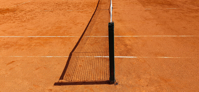 High angle shot of net in tennis court under the sunlight
