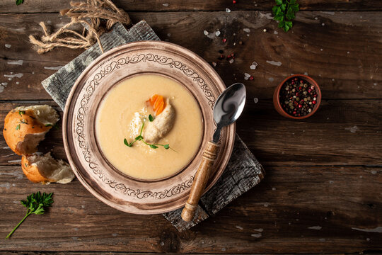 Delicious cream Brain soup, iskembe corbasi, turkish traditional hangover cure, diet fresh food meal dish soup lunch, space for text. top view