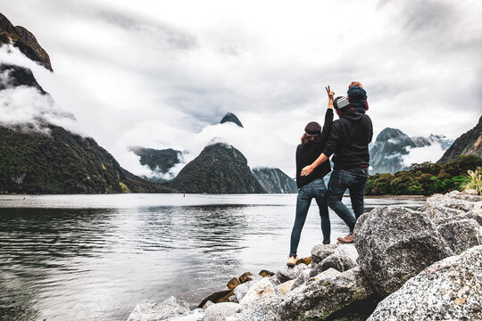 Happy Family In Milford Sound, New Zealand. 