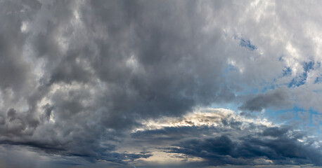 Fantastic dark blue thunderclouds at sunrise, natural composition