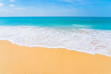 Fototapeta na wymiar Beautiful tropical beach sea ocean with white cloud and blue sky