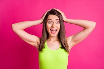 Fototapeta na wymiar Photo of pretty nice surprised young woman open mouth hands head wear lime top isolated vibrant pink color background