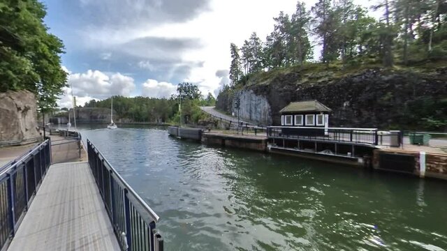 Sailing Boats Coming in and Out Water Lock, Timelapse Pan