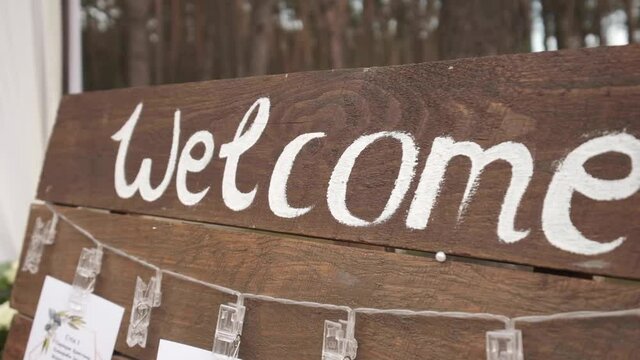 "Welcome"sign on the wooden board