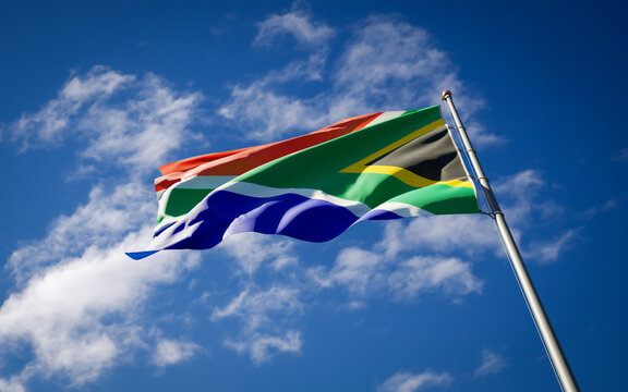 Beautiful national state flag of South Africa fluttering at sky background. Low angle close-up South Africa