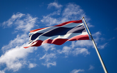 Beautiful national state flag of Thailand fluttering at sky background. Low angle close-up Thailand