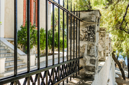 Evia island, Greece - June 28. 2020:Metal fence from a street in Greece 