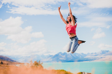 Happy woman jumping high