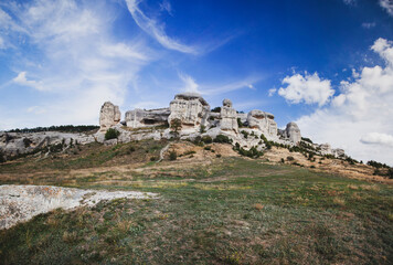 Fototapeta na wymiar Russia. Crimea. Bakhchisarai. Stone pillars. Stone sphinxes of Bakhchisaray in Crimea. Big panoramic.