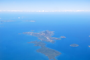 Panoramic view of  our blue planet from the plane and islands in the ocean  make infinity effect with sky