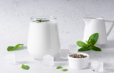 Indian cold drink salty Lassi. It is prepared on the basis of yogurt with the addition of water, salt, sugar, spices, fruit and ice by rapid whipping.