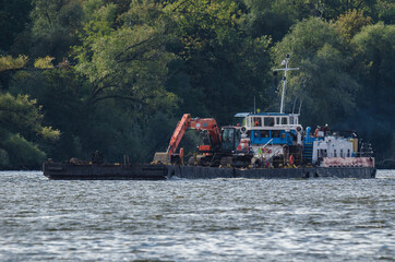 PUSHER TUG AND BARGE - A floating platform with on deck excavator for hydrotechnical works on the...
