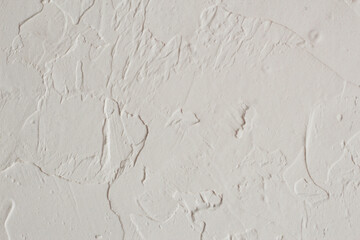 White painted wall. Simple desigh. Decorative 
plaster