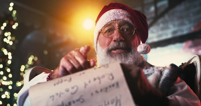 Santa Clause reading scroll and speaking with camera