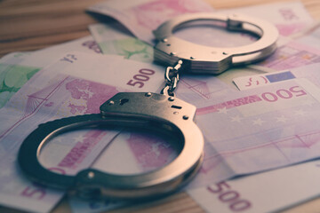 money and handcuffs bribery of the authorities