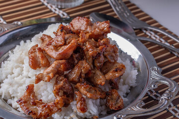 Fried Garlic and Pepper Pork on a Metal Plate
