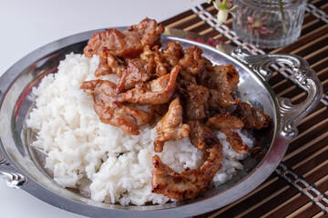 Fried Garlic and Pepper Pork on a Metal Plate