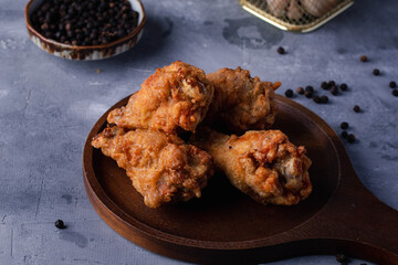 Fried chicken on a wooden board