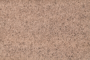 Light brown fluffy background of soft, fleecy cloth. Texture of beige textile.