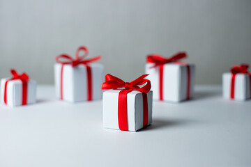 White gifts with red ribbons. Set of gift box isolated on white background.Christmas gift boxes on white background. Merry Christmas and Happy Holidays greeting card, frame, banner. New Year. Panorama