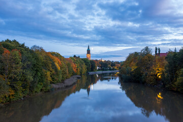 Fototapeta na wymiar Aura river and the tower of Turku Cathedral in autumn in Turku, Finland