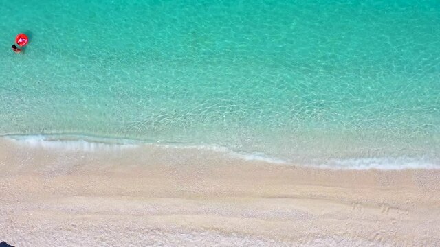 Beautiful, aerial view to the turquoise sea of the popular Myrtos beach at the Ionian island of Cephalonia, Greece, during summer time