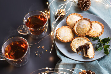 mince pies on a plate shot from above. A mince pie is a traditional Christmas sweet pie, filled with a mixture of dried fruits and spices.
