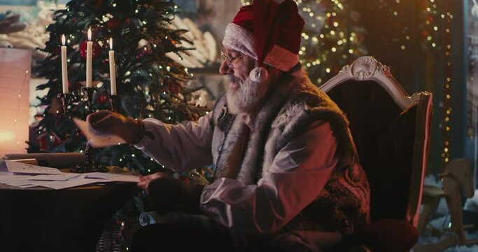 Santa Clause reading letters and scroll