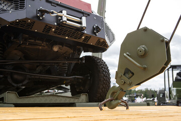 Loading a military vehicle using a truck crane. Selective focus. Close-up © Dmitry