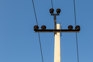 High voltage Electric power line support and wires. blue sky.