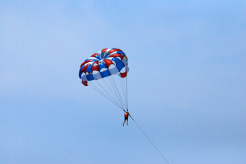 Sport Activity on the sea - parasailing over the blue sea in an bang beach hoian vietnam